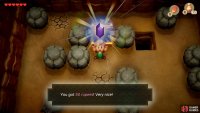 head into the cave and move the stones around to grab the 50 Rupees, 