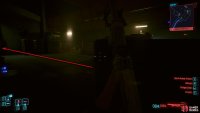 At the end of the tunnel, you’ll be in a large room full of enemies, turrets, and cameras.