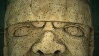 The real sculpture has a straight face