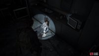 Crawl through the hole to the right of the stairs to find this Artefact by a body
