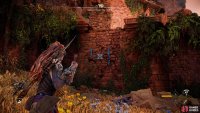 Use your grapple to break a hole into the wall