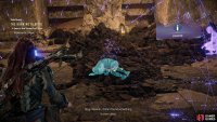 When you reach the tunnel, scan some rubble to find a buried body.