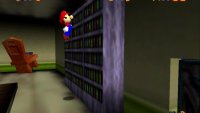 You will find the second coin on top of this bookshelf