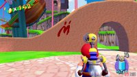 A piece of graffiti is on the orange arch just past the shell ride