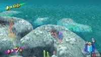 The red coins are hidden in between seaweeds and anemones within the coral reef