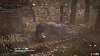 You’ll need to destroy the wooden boxes before you can move the second barricade.