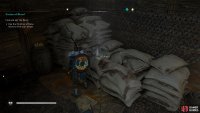 You’ll find the first clue on top of some sacks in the building.