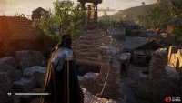 You’ll find the paper atop some stone ruins.
