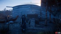 You’ll find the flying paper on top of the shipyard building.