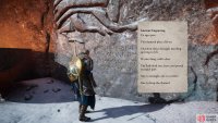 Read the inscription on the stone to see the waterfall behind you.