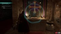 Investigate the symbol on the tapestry.
