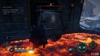 The second ingot can be found inside the building behind this boulder.