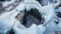 Drop down from the rope onto the roof of the building, which you can destroy to gain access.