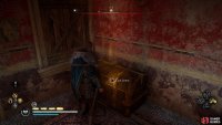 You’ll find the chest inside the building after pushing the barricade in.