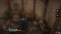 The chest can be found in a roundhouse within the camp.