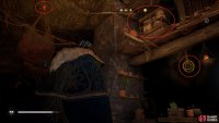 Shoot the link holding the cargo in place, then climb to the platform with the barricade and move it to gain access to the chest.