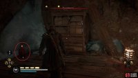 Move the barricade and take the fire pot to its left as you continue through the cavern.
