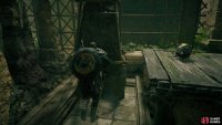 Move the stone pillar on the other side of the elevated wooden platform, then pickup the object to jump over the stone with it.
