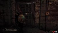 Use the key to open the door with the note beside it.