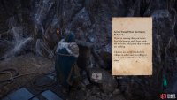 Read the note within the cave.