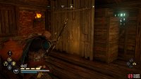 You’ll find the chest behind a wooden barrier within the house.