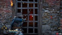 You’ll need to shoot the door lock from the northern side of the building to get inside.