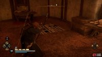 Shoot the wooden floor at the northwestern end of the warehouse.