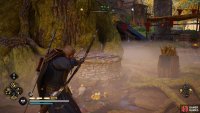 Shoot the wood on top of the well to jump down it.