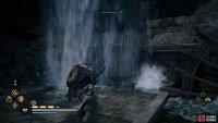 Shoot the wooden barricade to the west to reveal the stone pillar.