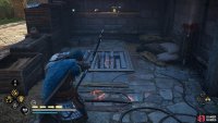 You’ll need to shoot the wooden barrier to reveal the cursed symbol behind it.