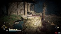 When you reach the area, you’ll need to shoot the wooden barrier on the well to jump down.