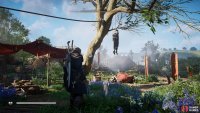 Take the key from the corpse hanging from a tree outside the warehouse.