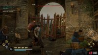 You can throw a fire pot at the blockade to destroy it.