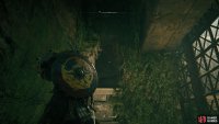 Throw the object through the hole from the stone pillar.