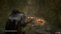 Throw a torch on the ground near the barricade to destroy it.