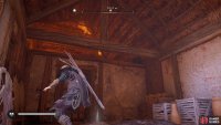 Head up into the attic area to then drop down into the room behind the barred door.