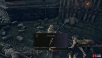 Loot a corpse south of the ballista to obtain a Stonesword Key.