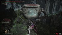 Warrior Jars, both large and small, rest amid the cliffside cemetery.