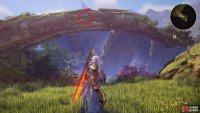 look on the edge of the stone arch to find it.