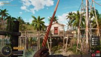 Use the grapple point from the windmill and swing over to the house 