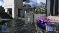 The centre of your reticle will be highlighted in yellow when looking at a surface which can be grappled to.