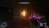Shoot the power core above the door to remove the energy barrier