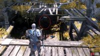 After grappling over, turn right (west) and look down to see the Lore Marker.