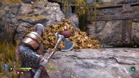 Hit the red fire pot with your axe to destroy the rubble and access the wall to climb.