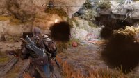 You need to take a bomb from here and throw it at the chest to break the gold around it.