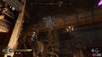 Throw the axe in this point above the waterwheel.