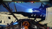 You can enter the Freighter and dock through the blue light emissions, similar to those on space stations.