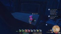 Climb the steps and jump into the metal towers opening to find the chest.