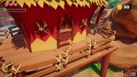 Follow the wooden walkway to the door of the red building