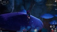 The cookbook is on top of the mushroom with moss as you climb the cavern.